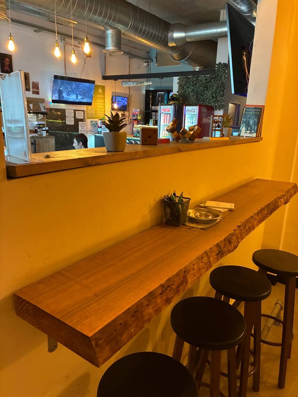 The wooden bar with stools